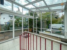 Wintergarten Lichtdurchflutete 3-Zimmer-Wohnung mit Wintergarten, Garten und Terrasse in ruhiger Lage